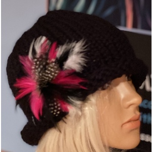 Women’s rolled brim cloche hat with a feather brooch. by Sherri Gold