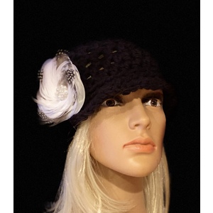 Women’s black cloche hat with a decorative feather brooch  by Sherri Gold