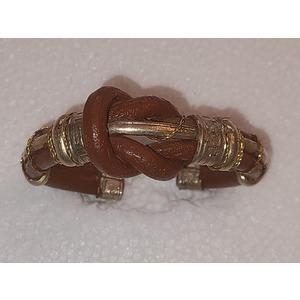 Leather knot cuff by Sergio Barcena