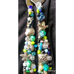 Seahorse with  oceanic beaded flatware by Sharon Lippert