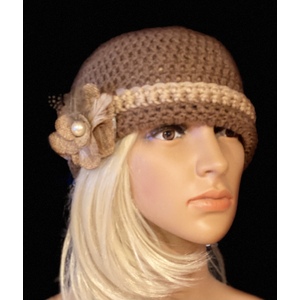Women’s winter hat with a decorative brooch. by Sherri Gold