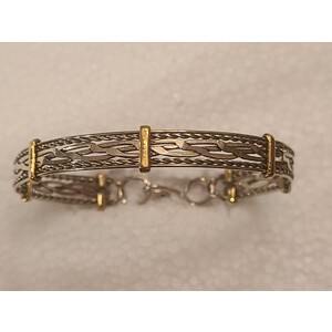bangle all silver around with brass accent by Sergio Barcena