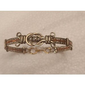 love knot with decorative copper bangle by Sergio Barcena