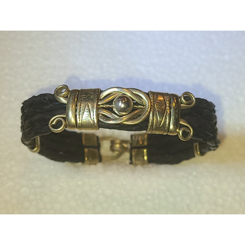 Multi strand braided leather bracelet with love knot by Sergio Barcena