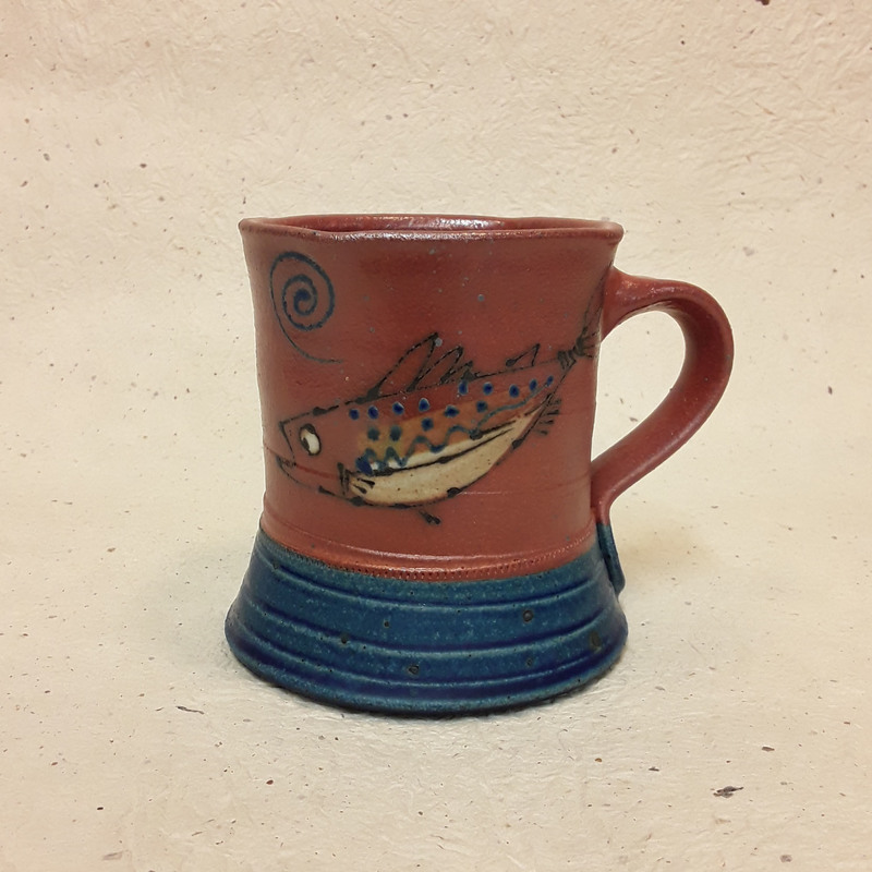 Stoneware mug with trout/salmon motif by Mary Jo Schmith