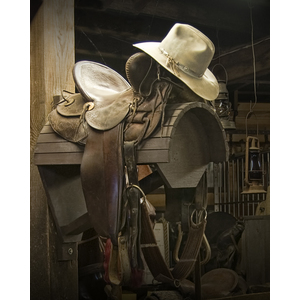 Western Horse Saddle and Cowboy Hat by Randall Nyhof