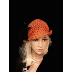 Women’s orange brimmed hat by Sherri Gold