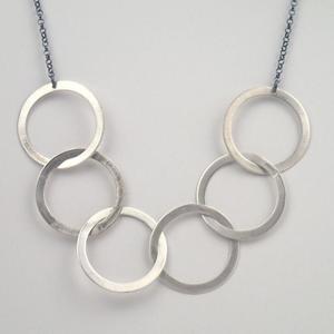 Silver six ring necklace by Lauren Mullaney