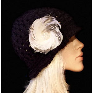 Women’s black cloche hat with a decorative feather brooch  by Sherri Gold