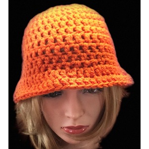  Women’s tangerine cloche hat with a white feather brooch by Sherri Gold